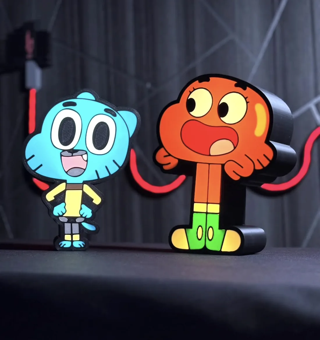 Two cartoon character custom 3D-printed lamps with LED-lit bases