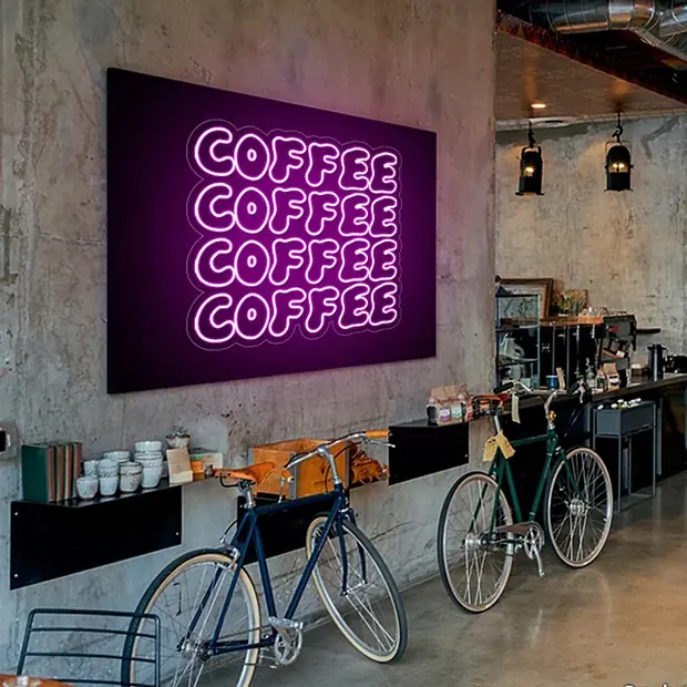 COFFEE neon sign repeated four times on a cafe wall